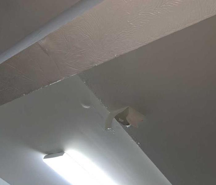 Garage ceiling drywall in home in Westminster falling apart from water damage