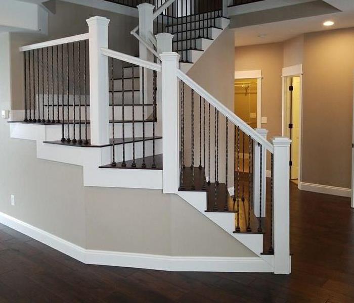 Restored from fire damage home in Lafayette, CO; restored banister and staircase