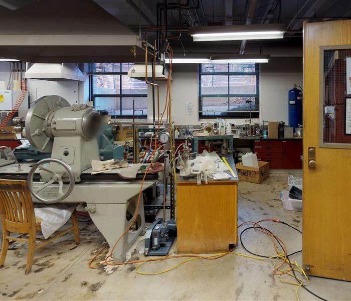 Fire and smoke damage in a university laboratory.  Smoke damage on the floors and equipment can be seen. 