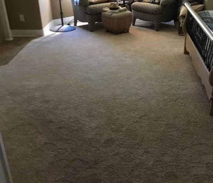 master bedroom carpet flooded with water in Broomfield home
